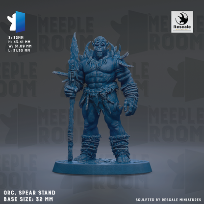 a blue warrior figurine standing on a spear stand, holding a spear in its right hand. The figurine is wearing a large, imposing armor and has a fierce expression on its face. The figurine is set against a dark background, which emphasizes its size and strength. The base size of the figurine is 32mm.