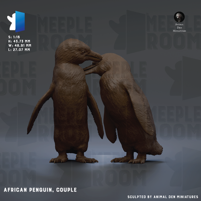two African penguins, a couple, standing close together and appearing to interact with each other.