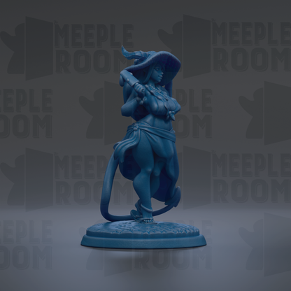 A blue figurine of a woman with a large hat and flowing skirt, standing on a base and holding a staff.