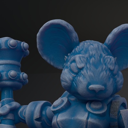 A close-up view of a blue, sculpted toy resembling a mouse or rat, with a detailed and intricate design.