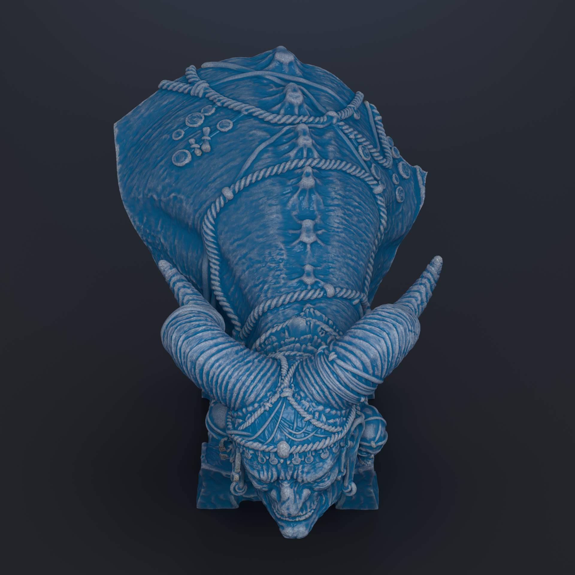 A blue, sculpted statue of a mythical creature with horns and intricate details, set against a dark background.