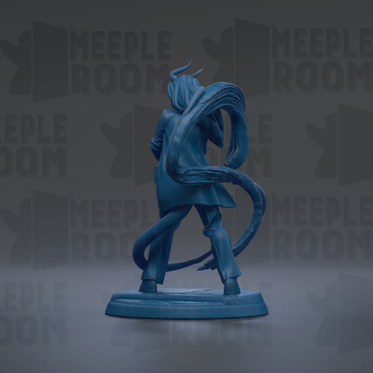 A blue figurine of a person with horns and a flowing cape, standing on a base and facing away from the camera.