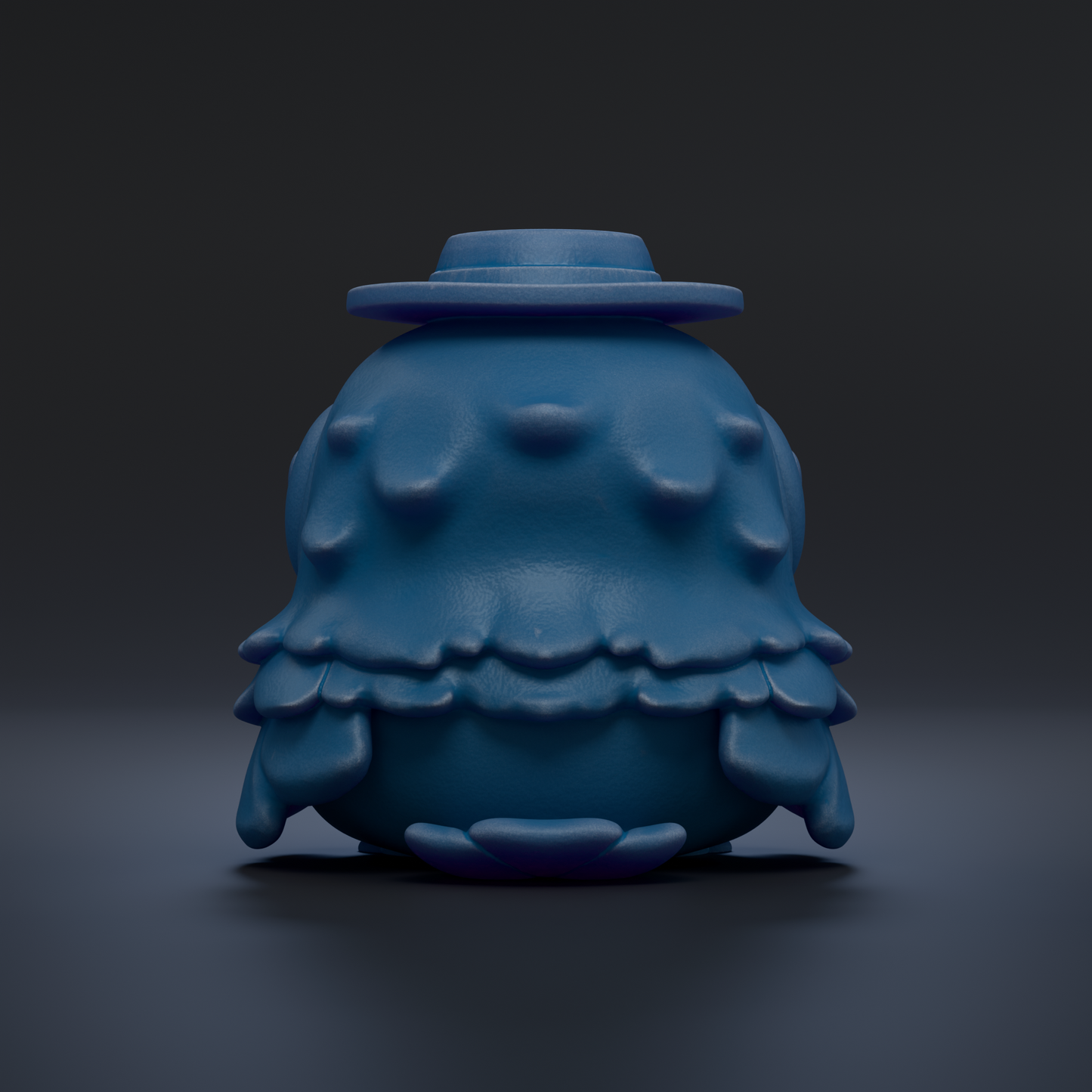 A blue, 3D-rendered object resembling a small, round, and textured figure with a hat on top, set against a dark background.