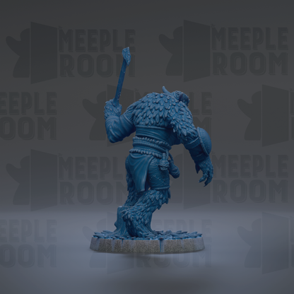 A blue, furry creature holding a weapon and standing on a rock.
