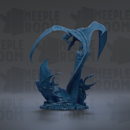 A blue dragon statue with wings spread wide, standing on a base.