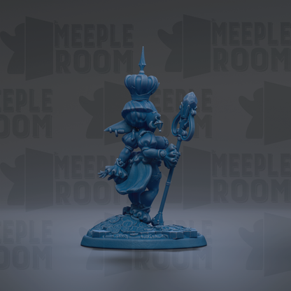 A blue figurine of a character with a crown and a staff, standing on a base.