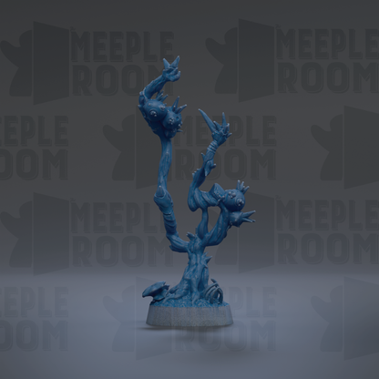A blue, abstract sculpture resembling a tree or plant with various organic shapes and textures.