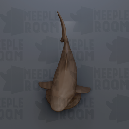 a shark with a dark brown color and a curved tail fin.